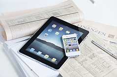 iPad, iPhone auf Finanzzeitung